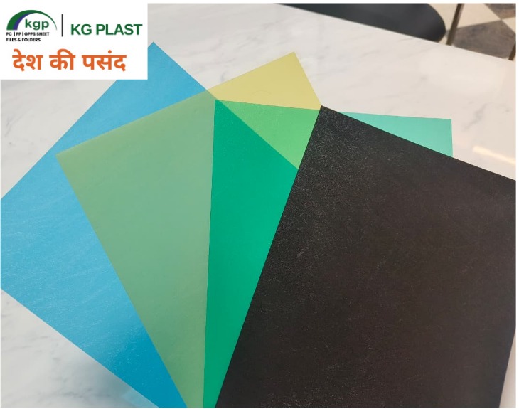 Fanned assortment of colorful polypropylene plastic sheets in blue, green, yellow, and black by KG Plast.