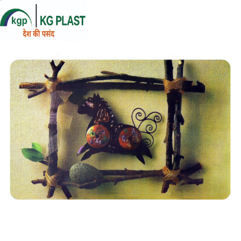 A table mat featuring a rustic twig frame enclosing a decorated dark horse figure and a stone against a light background.